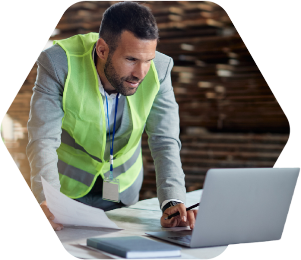 Gordian | Building Intelligence Solutions Fueled by Insights, Technology and Expertise 11 Construction worker on laptop.