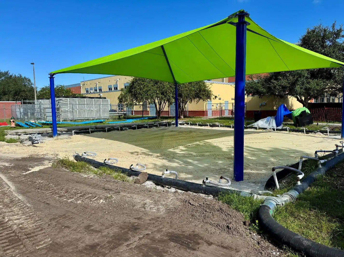 Stone-Lakes-Elementary-Playground-Progress After the storms cleared, crews dewatered the site and filled in the playground with new sand.